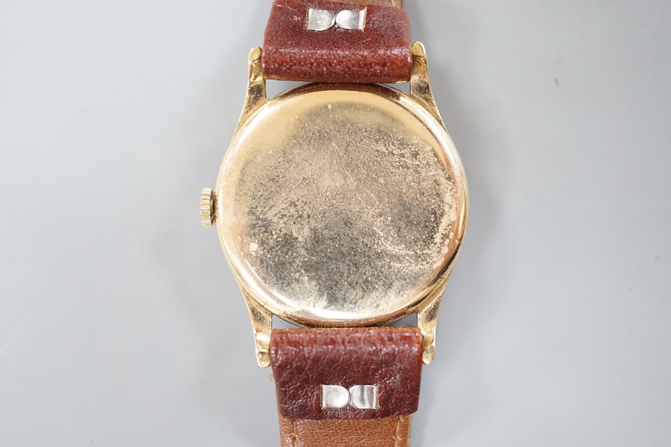 A gentleman's 9ct gold Record manual wind wrist watch, on a brown leather strap, case diameter 32mm